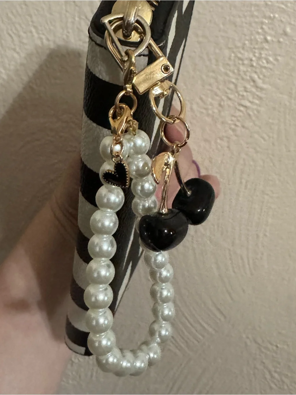 kate spade Black and White Check Zip-Around Wristlet with Pearl Strap